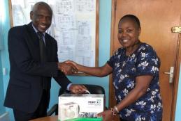 Prof. Susan Mbugua presenting the Portable Digital Dental X-ray Unit to the Chairman of the Department of Clinical Studies, Prof. J. Nguhiu-Mwangi on September 30, 2019 .